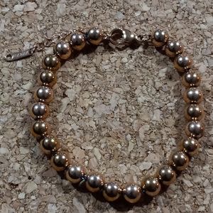 Rose gold tone steel bead bracelet